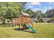 Community playground showcasing a wooden playset with a slide and swings at 261 Palm St, Mount Pleasant, SC 29464