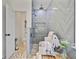 Modern bathroom showcasing a large tiled shower with a built-in bench at 261 Palm St, Mount Pleasant, SC 29464