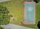 Aerial view of a tennis court near outdoor workout equipment surrounded by mature trees at 261 Palm St, Mount Pleasant, SC 29464