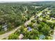 An aerial view of a single-Gathering home nestled among lush trees in a serene neighborhood setting at 267 Industrial Rd, Walterboro, SC 29488