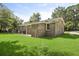 Backyard showing the back of the house with a spacious, well-maintained lawn at 267 Industrial Rd, Walterboro, SC 29488