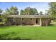 Backyard showing the back of the house with a spacious, well-maintained lawn at 267 Industrial Rd, Walterboro, SC 29488