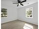Bedroom with fan and two large windows at 267 Industrial Rd, Walterboro, SC 29488
