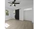 Bedroom with large window, barn door and closet at 267 Industrial Rd, Walterboro, SC 29488