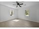 Bedroom with fan and two large windows at 267 Industrial Rd, Walterboro, SC 29488