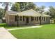 Charming single story brick home with a manicured front lawn at 267 Industrial Rd, Walterboro, SC 29488