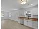 Bright kitchen featuring white cabinetry, stainless steel appliances, and beautiful butcher block countertops at 267 Industrial Rd, Walterboro, SC 29488