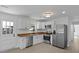 Modern kitchen with stainless appliances, butcher block countertops, and a stylish white backsplash at 267 Industrial Rd, Walterboro, SC 29488