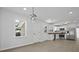 Modern kitchen with white cabinets, stainless steel appliances, wood countertops, and stylish lighting at 267 Industrial Rd, Walterboro, SC 29488