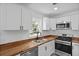 Well-equipped kitchen featuring stainless steel appliances, white cabinetry, and ample counter space at 267 Industrial Rd, Walterboro, SC 29488