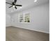 Bright living room with large window, new flooring and neutral paint, ready for personalization at 267 Industrial Rd, Walterboro, SC 29488