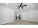 Open-concept living space featuring sleek flooring, recessed lighting, and view to kitchen with stainless appliances at 267 Industrial Rd, Walterboro, SC 29488