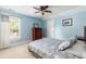 Light blue bedroom featuring a comfortable bed, dresser, and window with bright natural light at 2941 Murraywood Rd, Johns Island, SC 29455