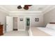 Spacious primary bedroom with white trim, neutral walls, carpeted floors, and a view into the ensuite bathroom at 2941 Murraywood Rd, Johns Island, SC 29455