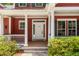 The front door is framed by white columns and decorative shrubbery at 2941 Murraywood Rd, Johns Island, SC 29455