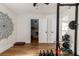 Bright home gym space with hardwood floors, large mandala wall art, and workout equipment at 2941 Murraywood Rd, Johns Island, SC 29455