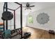 Home gym featuring free weights, a squat rack, and wood floors at 2941 Murraywood Rd, Johns Island, SC 29455