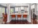 Eat-in kitchen island, stainless appliances, with white cabinetry and marble countertops at 2941 Murraywood Rd, Johns Island, SC 29455