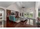 Bright living room with vaulted ceilings, hardwood floors, and custom built-in shelving at 2941 Murraywood Rd, Johns Island, SC 29455