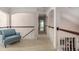Second-story loft area with railing and seating for relaxing and enjoying natural light at 2941 Murraywood Rd, Johns Island, SC 29455