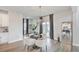 Dining area featuring a modern chandelier, neutral decor, and sliding glass door leading to backyard at 306 Lucca Dr, Summerville, SC 29486