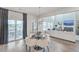 Elegant dining area with a modern light fixture, opening to the living room at 306 Lucca Dr, Summerville, SC 29486