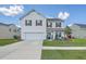 Charming two-story home with a well-maintained lawn and a spacious driveway at 306 Lucca Dr, Summerville, SC 29486