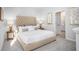 A cozy bedroom with soft carpet, with a tufted headboard bed and neutral walls at 326 Tiliwa St, Summerville, SC 29486