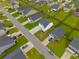 Aerial view capturing a home's location within a well-planned community, highlighting its yard and nearby streets at 330 Bountiful Dr, Moncks Corner, SC 29461