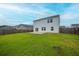 The backyard has a spacious lawn, fenced perimeter, and patio at 330 Bountiful Dr, Moncks Corner, SC 29461