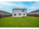 Large backyard featuring a well-kept lawn, wood fencing, and patio at 330 Bountiful Dr, Moncks Corner, SC 29461