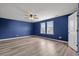 Comfortable bedroom with two windows for plenty of light and wood-look floors at 330 Bountiful Dr, Moncks Corner, SC 29461
