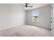 Bedroom features neutral carpet, a ceiling fan, and window letting in natural light at 330 Bountiful Dr, Moncks Corner, SC 29461