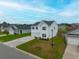 Inviting two-story home with a well-maintained lawn and blue shutters, nestled in a peaceful neighborhood setting at 330 Bountiful Dr, Moncks Corner, SC 29461