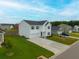 Lovely two-story home boasts a manicured lawn and a welcoming teal door, set in a vibrant neighborhood at 330 Bountiful Dr, Moncks Corner, SC 29461
