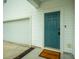 A welcoming front entrance featuring a stylish teal door, a smart lock, and a 'Welcome Home' mat at 330 Bountiful Dr, Moncks Corner, SC 29461