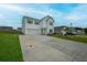 Charming two-story home with a two-car garage, a well-manicured lawn, and inviting curb appeal at 330 Bountiful Dr, Moncks Corner, SC 29461
