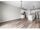 Open-concept kitchen featuring stainless steel appliances, quartz countertops, and a spacious dining area at 330 Bountiful Dr, Moncks Corner, SC 29461