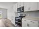Modern kitchen features stainless steel appliances, quartz countertops, and stylish subway tile backsplash at 330 Bountiful Dr, Moncks Corner, SC 29461