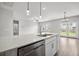 Kitchen island featuring quartz countertops, stainless steel dishwasher, and pendant lighting over the sink at 330 Bountiful Dr, Moncks Corner, SC 29461