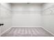 Empty walk-in closet with wire shelves and neutral colored carpet at 330 Bountiful Dr, Moncks Corner, SC 29461