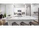 Modern kitchen with granite counters, white cabinets, stainless appliances, and an island with bar seating at 345 Pine Crest View Dr, Summerville, SC 29486