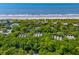 Scenic aerial view featuring oceanfront homes and a glimpse of the beautiful coastline at 3577 Shipwatch Rd, Kiawah Island, SC 29455