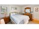 Cozy bedroom features stylish decor and a natural wood dresser with matching mirror at 3577 Shipwatch Rd, Kiawah Island, SC 29455