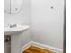 Bathroom featuring a pedestal sink, with wood floors at 4551 Great Oak Dr, North Charleston, SC 29418