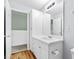 Neutral bathroom featuring a white vanity, a mirror, storage space and a linen closet at 4551 Great Oak Dr, North Charleston, SC 29418