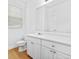 Bright bathroom with a large mirror and white vanity at 4551 Great Oak Dr, North Charleston, SC 29418
