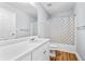 Neutral bathroom has a white vanity and a shower-tub combo with a decorative curtain at 4551 Great Oak Dr, North Charleston, SC 29418