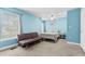 Cozy bedroom boasts a comfortable bed, a sofa, and soothing blue walls at 4551 Great Oak Dr, North Charleston, SC 29418