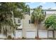 Well-maintained townhome featuring a two-car garage, dormer windows, and charming outdoor setting at 4551 Great Oak Dr, North Charleston, SC 29418